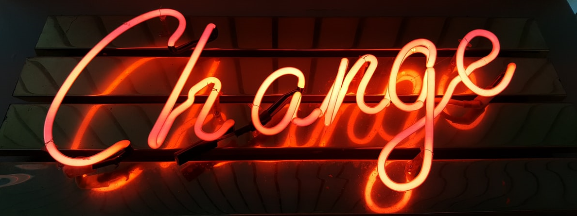 Photograph of a neon sign saying Change