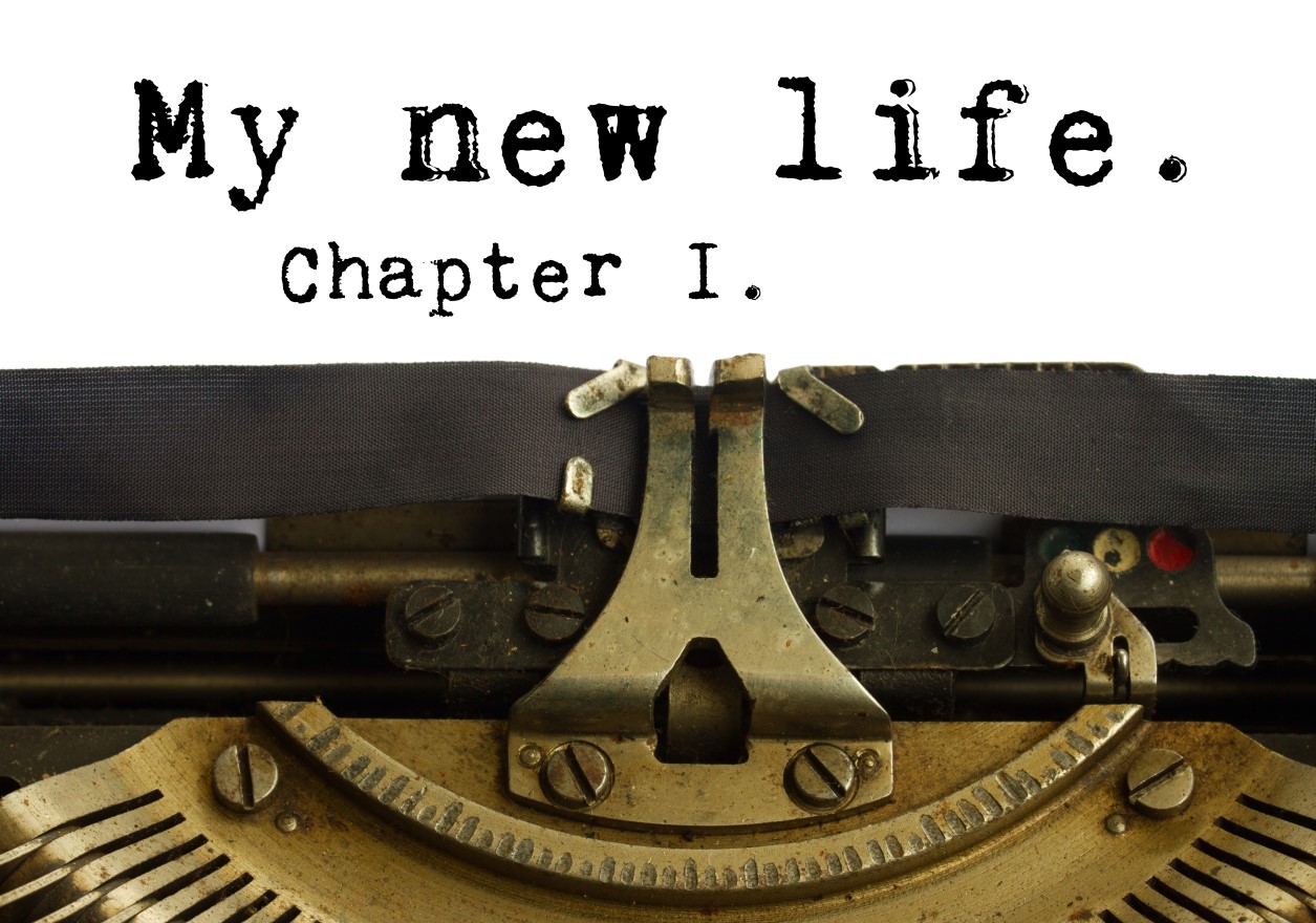 How do we define our identity?Old Fashioned Typewriter with a sheet of paper showing the title 'My New Life' Chapter 1.