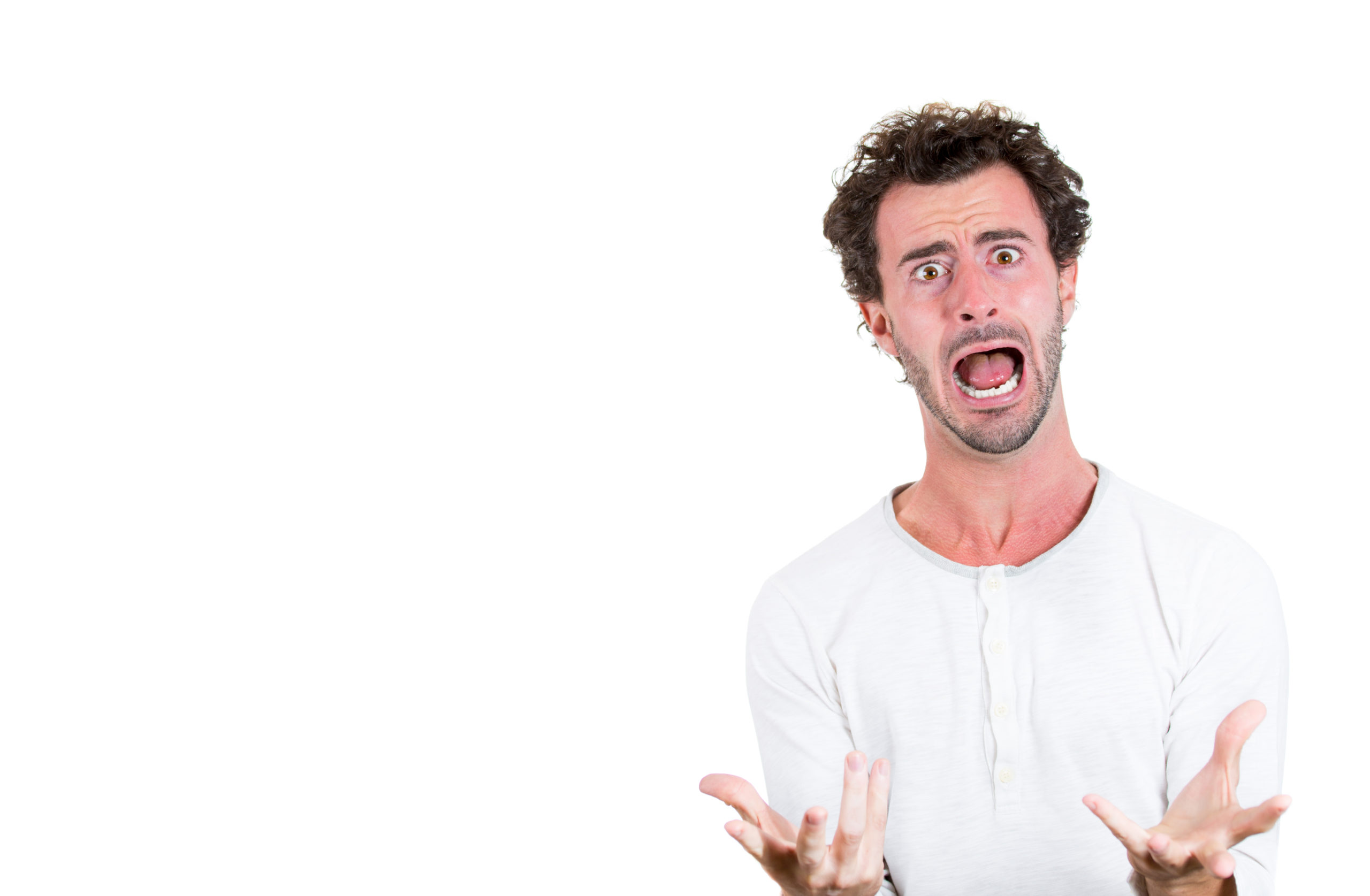 Man with open mouth and hands held out in front looking frustrated